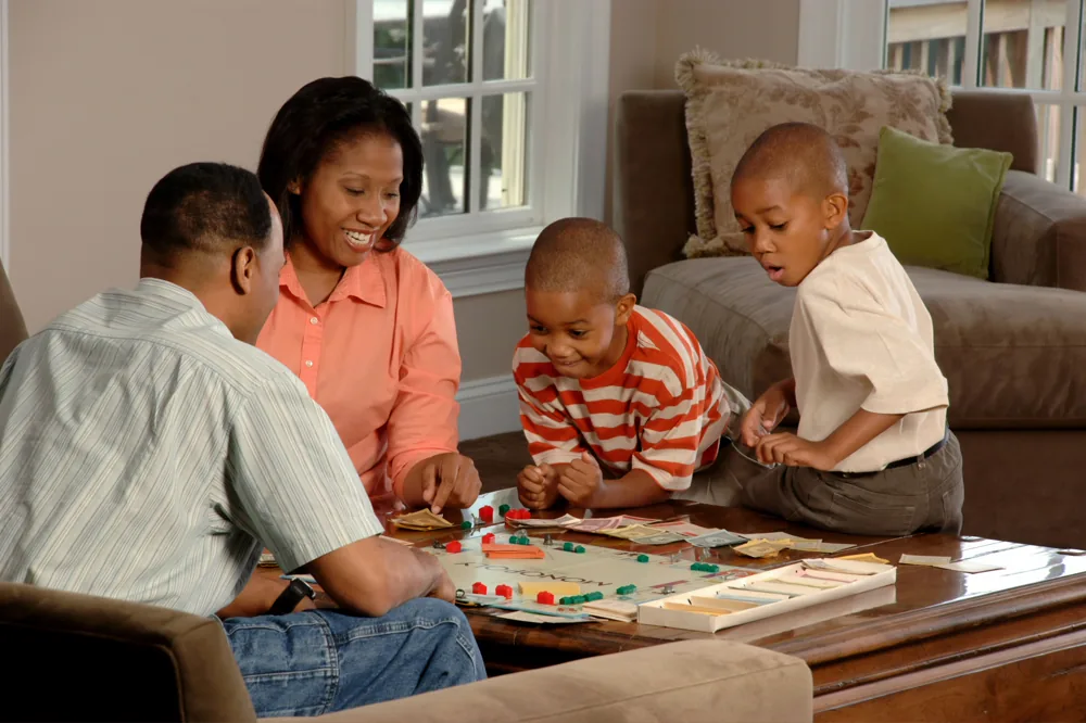 A family playing a game together at home.
